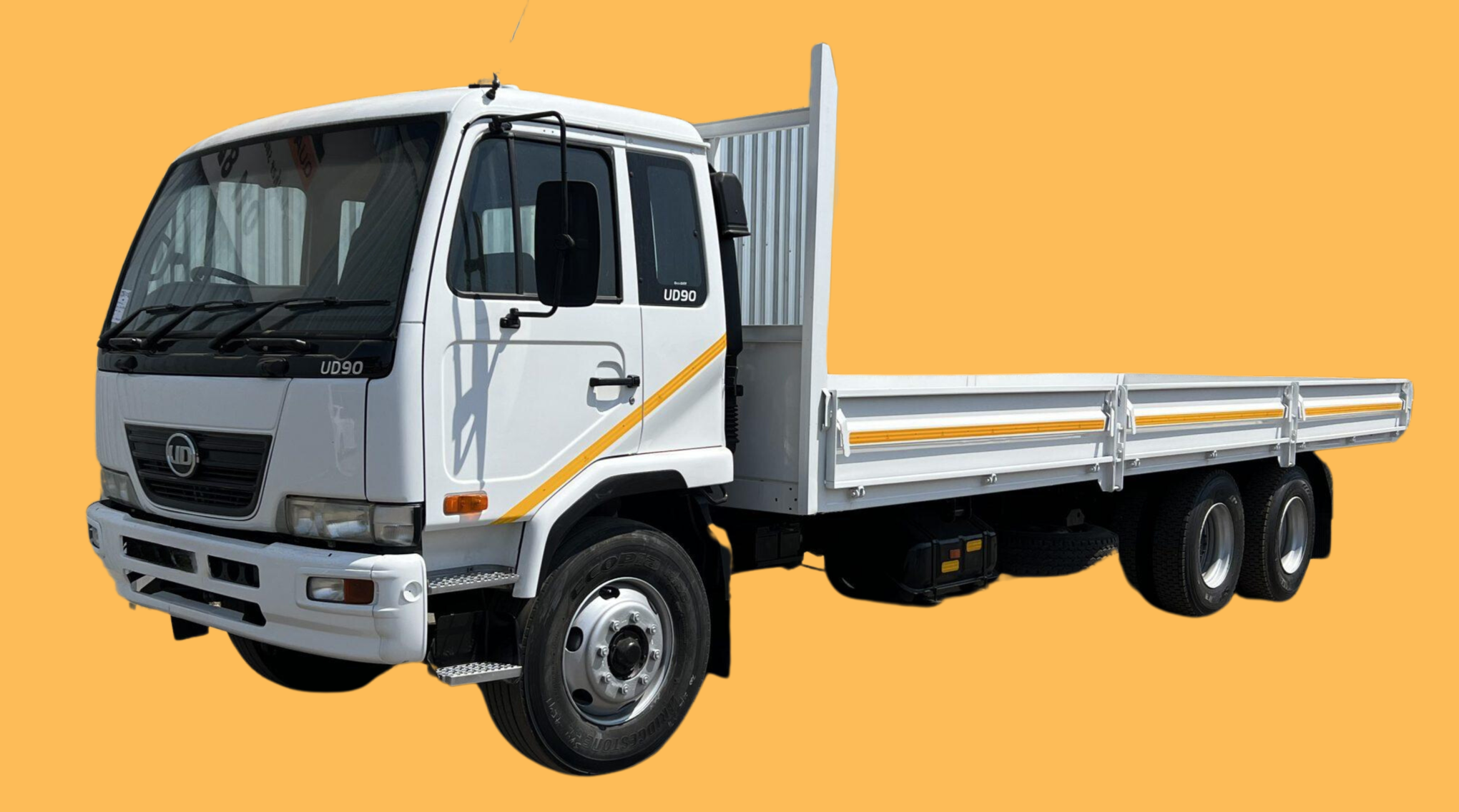 Nissan UD90 double axle dropside.